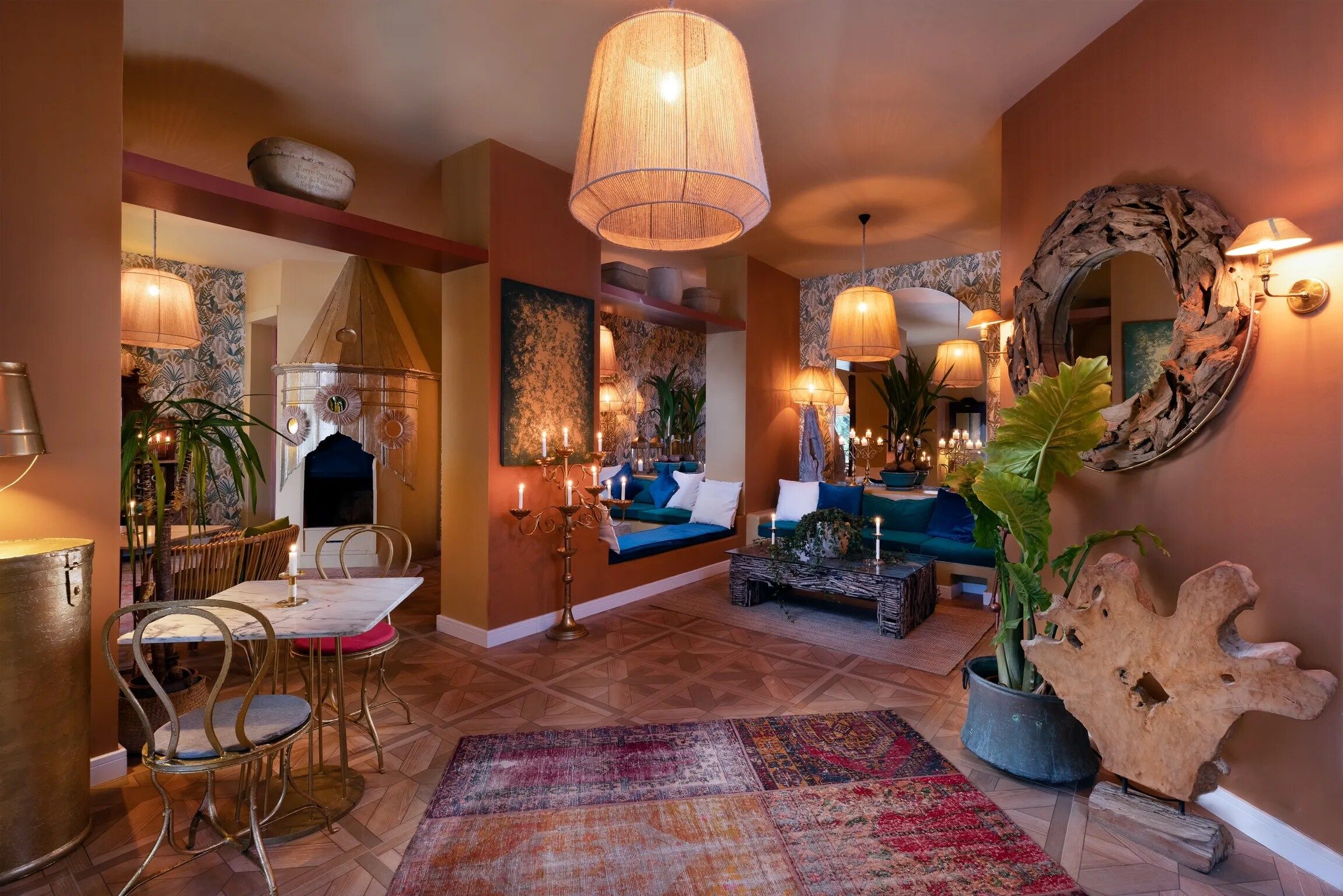 A well-lit interior with a dining area, seating, and decorative elements.