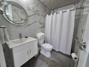 Shower, hair dryer, towels, soap