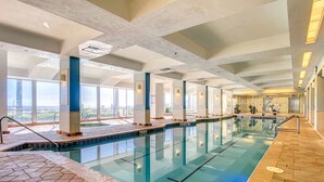 A large indoor swimming pool with clear water, tiled flooring, and a 3ft 6in depth marker. - Beachfront Studio - Sleeps 4 (Daytona Beach)