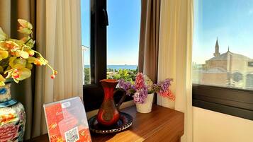 Luxury Quadruple Room, 1 Bedroom, Terrace, Sea View | Free minibar items, desk, free WiFi, bed sheets