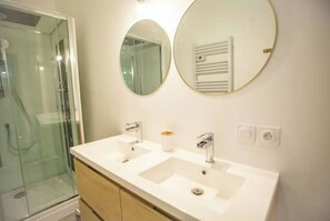 Shower, hair dryer, towels, soap