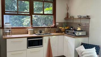 Fridge, microwave, stovetop, coffee/tea maker