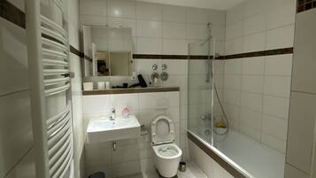 Combined shower/tub, hair dryer, towels, soap