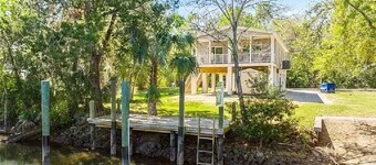 Waterfront home with dock and boat ramp
