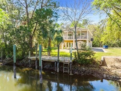 Waterfront home with dock and boat ramp