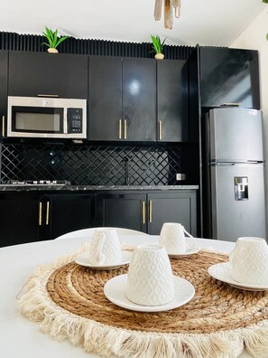 Fridge, microwave, coffee/tea maker, toaster