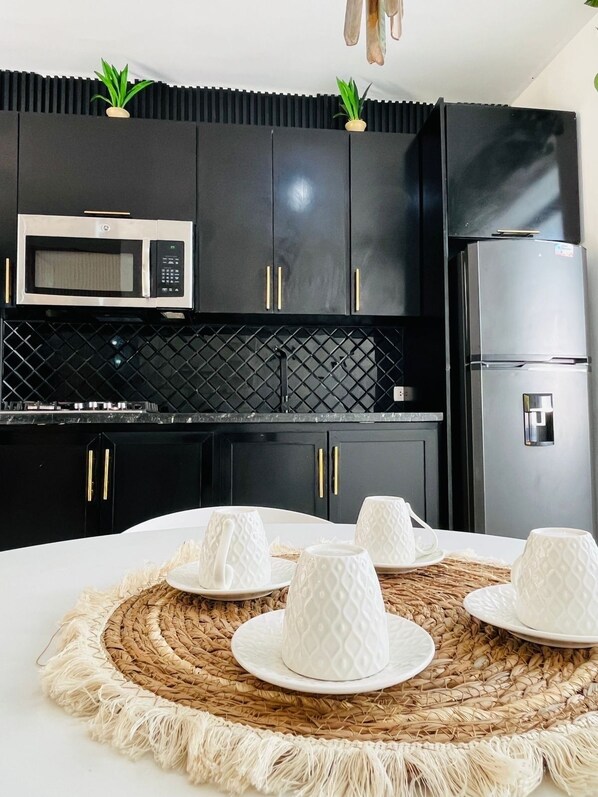 Microwave, stovetop, dishwasher, coffee/tea maker