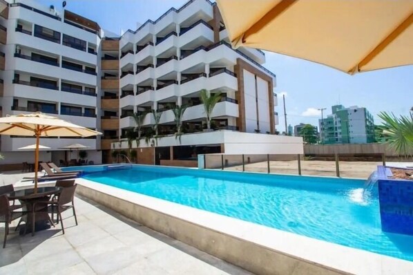 Outdoor pool, open 7:00 AM to 10:00 PM, sun loungers
