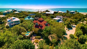 A coastal resort with multiple buildings, a swimming pool, and a beach view. - The Salty Conch - Luxury Just Steps To The Beach with Private Pool;2 Golf Carts (Captiva)