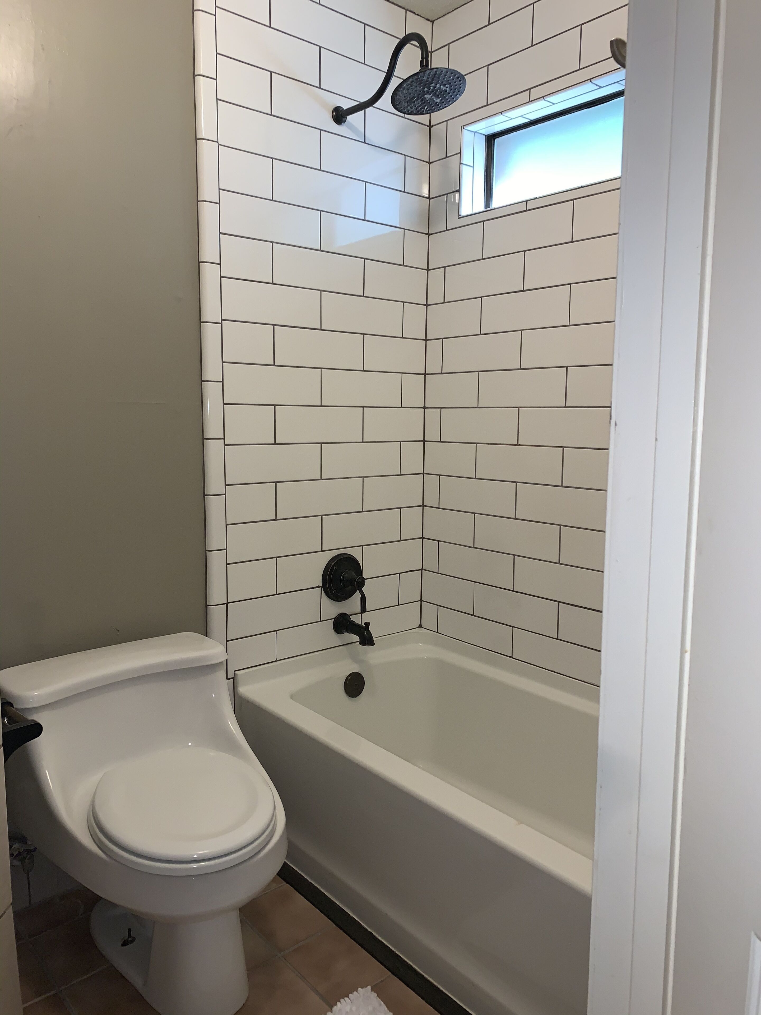 Combined shower/bathtub, hair dryer, towels, soap