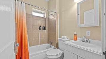 Bathtub, hair dryer, towels