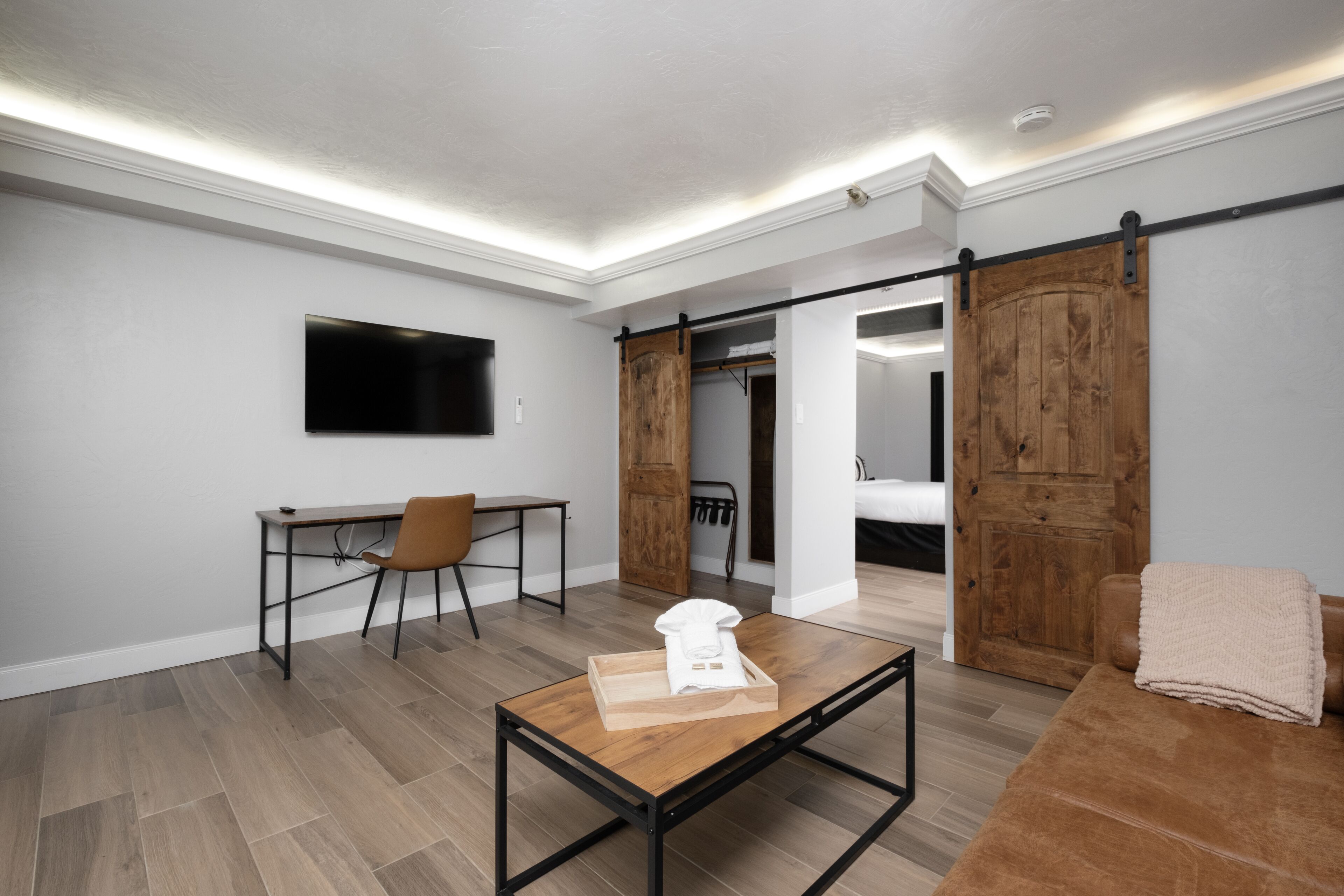 Deluxe Suite | Premium bedding, desk, laptop workspace, blackout curtains