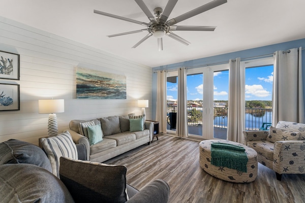 Living Area with Lake and Light Show Views, Flat Screen TV, Sleeper Sofa and Private Balcony Access