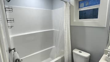 Combined shower/tub, hair dryer, towels, soap