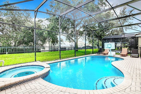 Enjoy our semi-private pool and enclosed lanai with a quite park-like setting