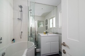 Bathtub, hair dryer, towels