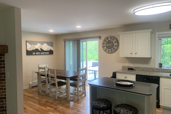 View from living room into kitchen and dining room