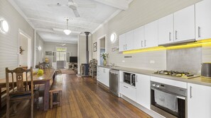 Enjoy cooking in this well-equipped kitchen with oven, gas stove, and dishwasher.