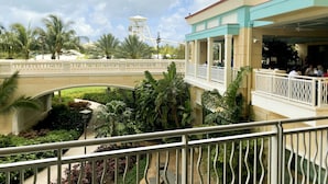 A hotel with a balcony overlooking a bridge and a roller coaster in the background. - Spacious 3-Bedroom Apartment with WiFi & AC in Lovely Nassau (Nassau)