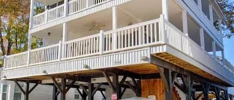 A two-story building with a balcony on the upper floor.