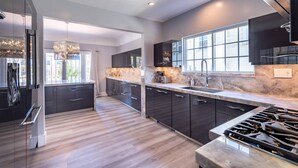 Coffee/tea maker, fridge, microwave, oven - Normandie Manor | 6BR Hollywood Sign Views, Chef's Kitchen, Gated + Dog Friendly (Los Angeles)