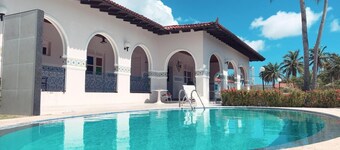 Your family vacation paradise with pool, palm trees and garden