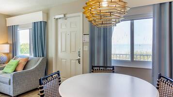 Suite, 2 Bedrooms | Living area | 50-inch TV with cable channels, DVD player