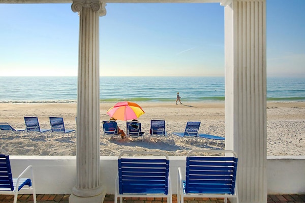 On the beach, white sand, sun loungers