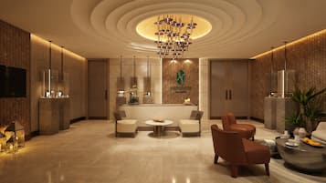 Relax in style at NEPHRITE, where a contemporary reception desk and cozy seating area await.
