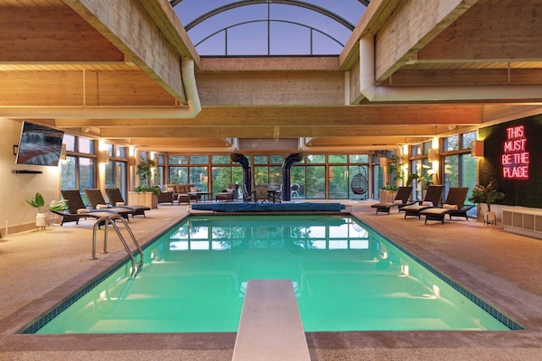 Dive into relaxation in this expansive indoor pool, where comfort meets luxury under the soothing embrace of natural light.