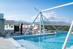Outdoor pool, open 8:00 AM to 8:00 PM, free cabanas, pool umbrellas