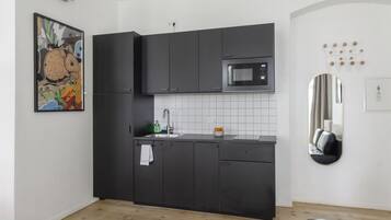 Fridge, microwave, stovetop, coffee/tea maker