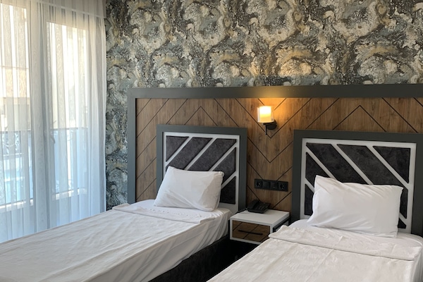 Chambre Deluxe avec lits jumeaux, 2 lits une place