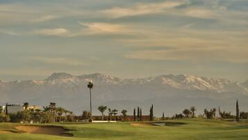 Enjoy a tranquil golfing experience on our well-maintained course with beautiful mountain views.