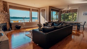Signature House, Terrace, Ocean View | Living room | 50-inch flat-screen TV with digital channels, TV, fireplace