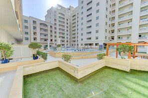 Outdoor pool - STUNNING STUDIO WITH MINIMALIST DESIGN in JVC!! (Dubai)