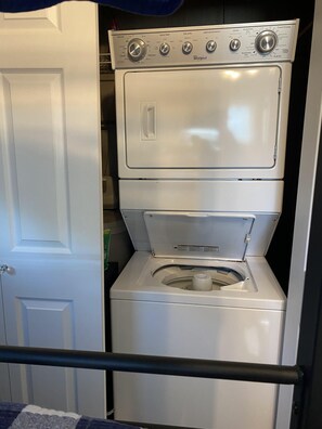 Convenient laundry facilities feature a washer and dryer with multiple settings.