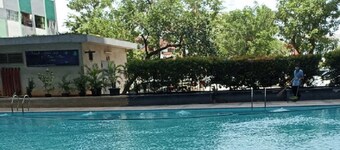 THE ROOMOS Hotel Apartemen