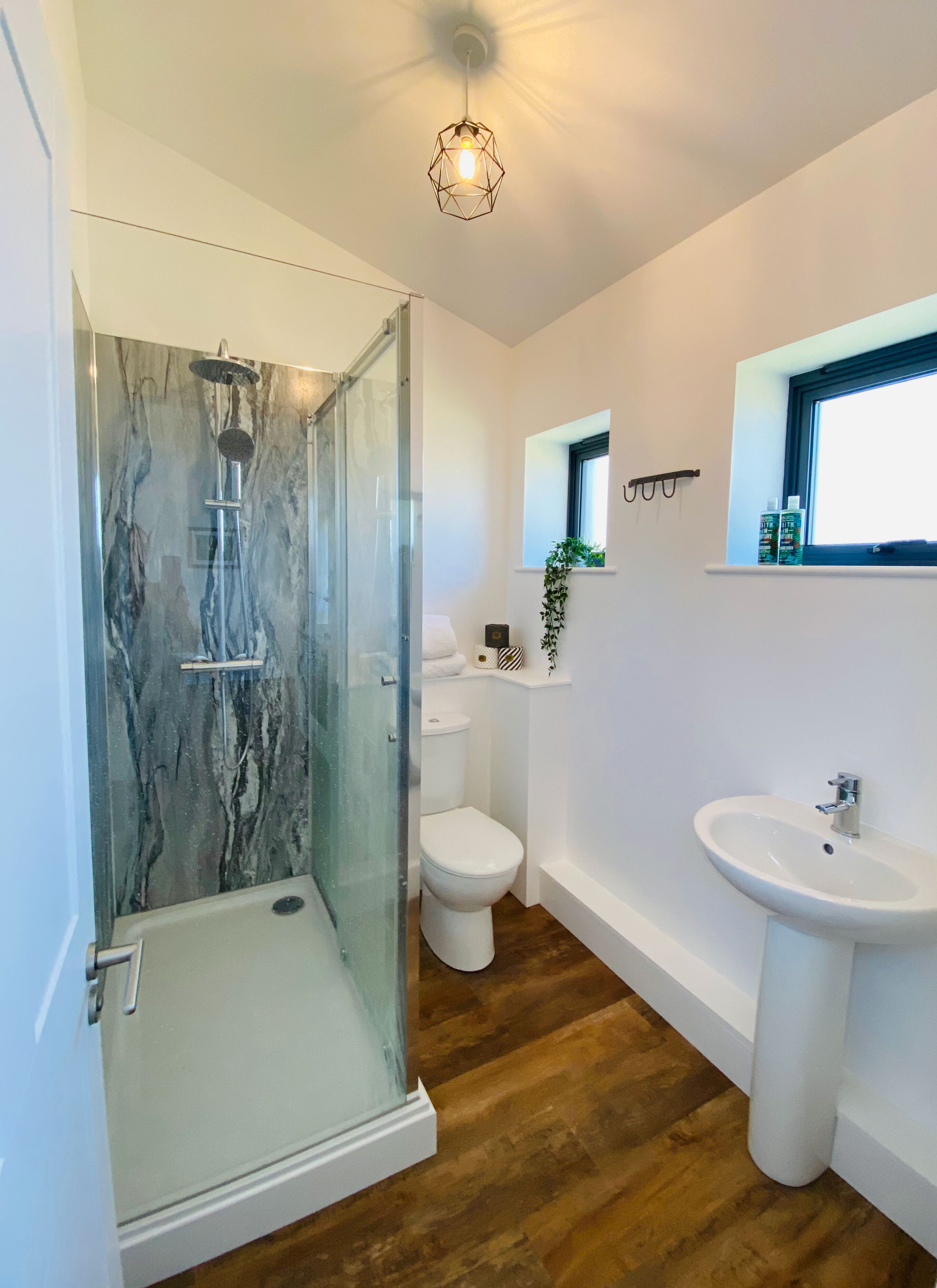 Shower, rainfall showerhead, hair dryer, towels