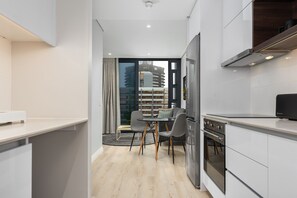 Fridge, microwave, oven, stovetop - Modern Apartment with 22nd Floor Views (Cape Town)