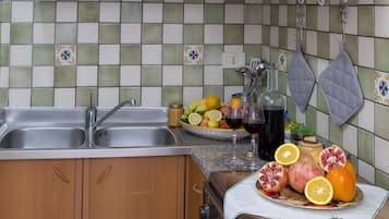 Fridge, oven, coffee/tea maker, cookware/dishes/utensils