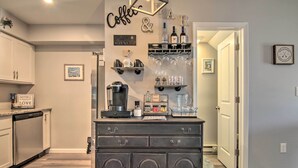 A kitchen with a coffee bar, a refrigerator, and a dishwasher. - Pool Access, Near Beach! Waterfront Ocean City Gem (Ocean City)