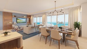 A modern dining area with a large table set for six, a sofa, and a TV mounted on the wall. - Just right (Puerto Plata)