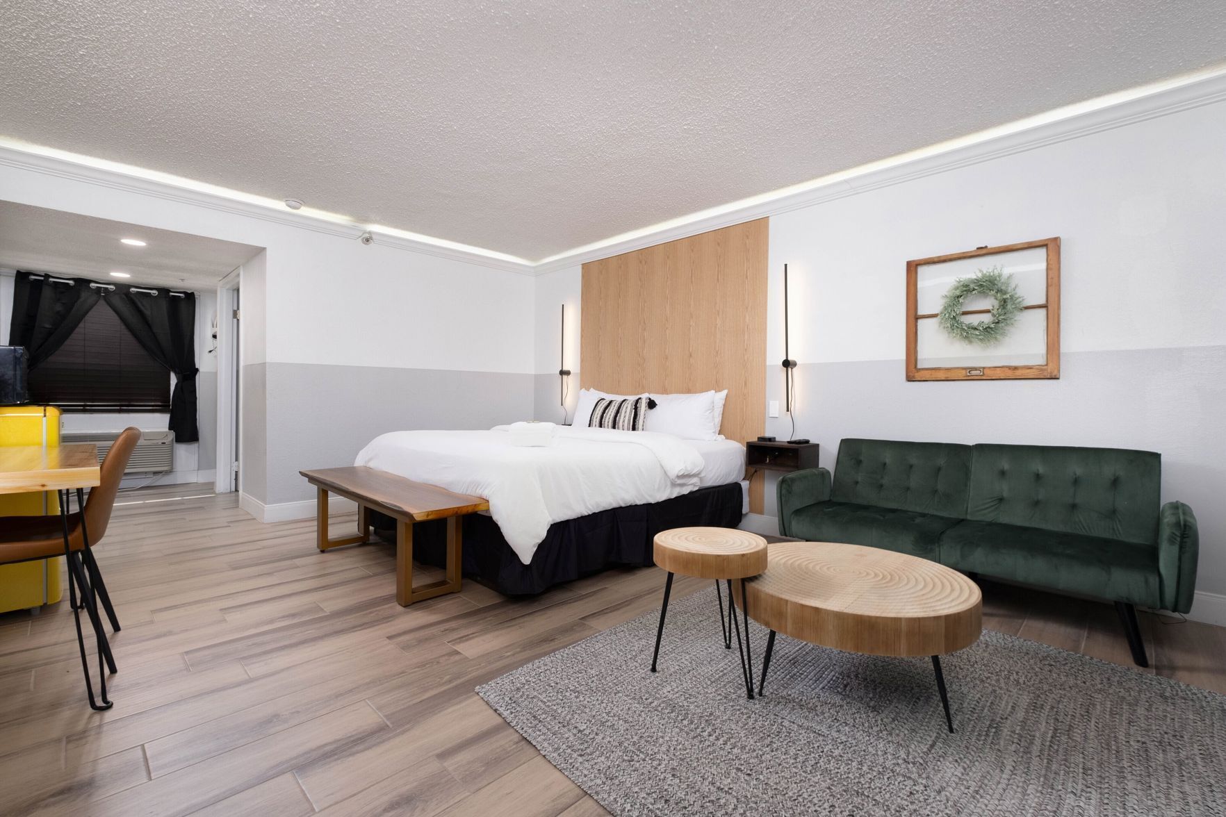 Premium bedding, desk, laptop workspace, iron/ironing board