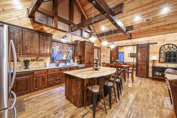 Dining - Patio in the Pines offers all of the luxuries in an absolutely stunning vacation cabin. One of the outstanding features is a HUGE 1,200 square foot covered outdoor living space with soaring ceilings, adorned with a wine barrel chandelier. (Broken Bow)