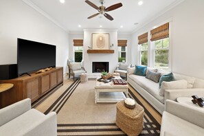 House, Multiple Beds, Private Pool, Partial Ocean View | Living area | TV, fireplace - All Decked Out (Santa Rosa Beach)