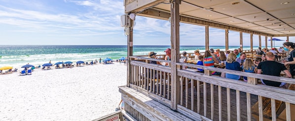 Enjoy a meal on the beachfront deck with ocean views.