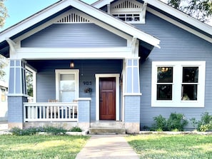 A two-story house with a front porch, a mailbox, and a number '905' on the wall. - Beautiful Craftsman Style Home; Peaceful backyard; Close to Main (Fredericksburg)