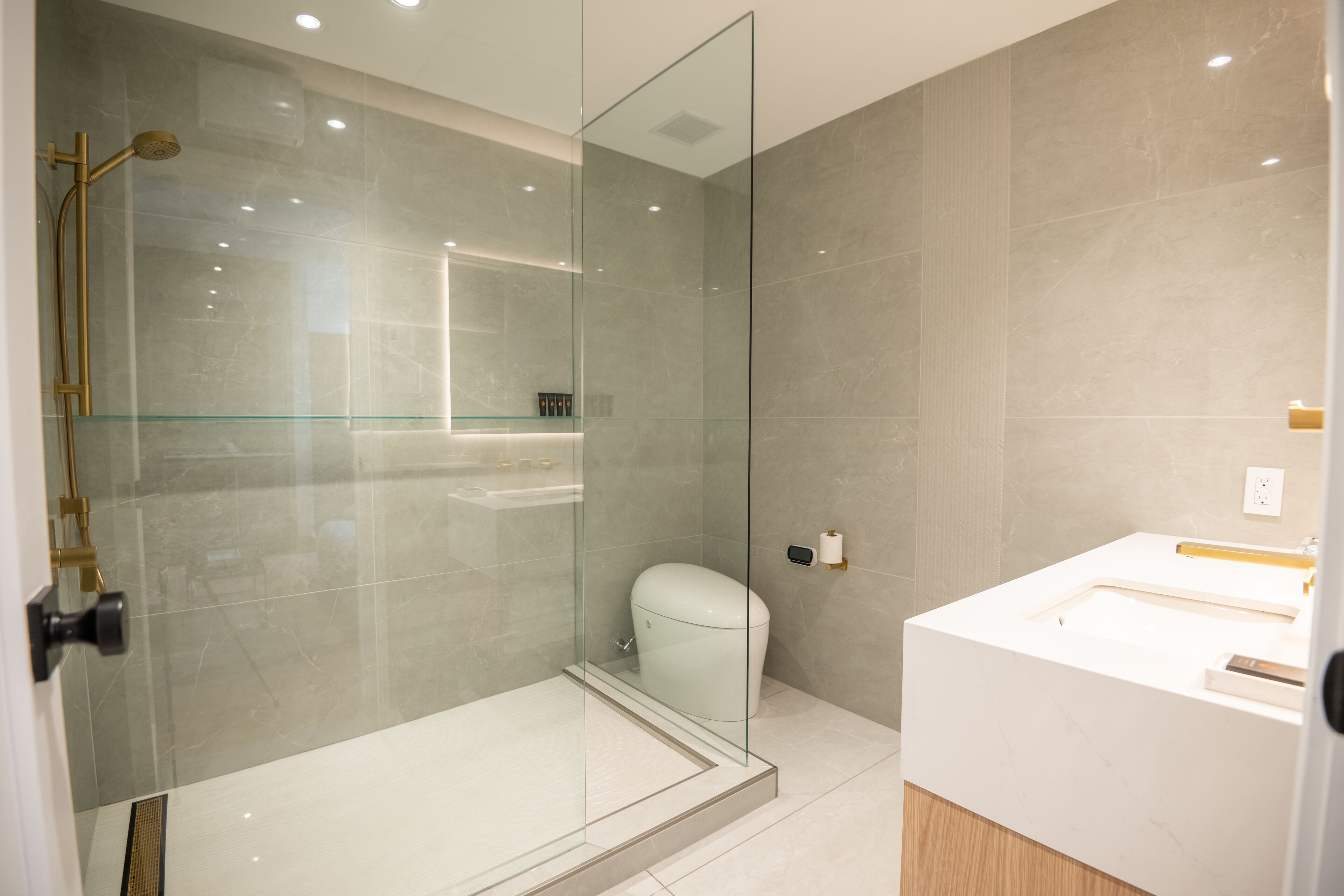 superior suite | bathroom | hair dryer, bathrobes, electronic bidet, towels