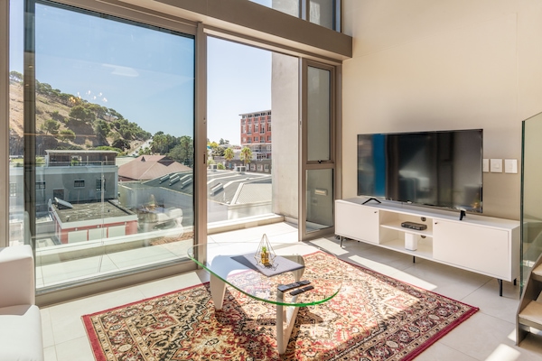Luxury Apartment, 1 Bedroom, Kitchen, Mountain View | Living area | 55-inch Smart TV with cable channels, TV, Netflix